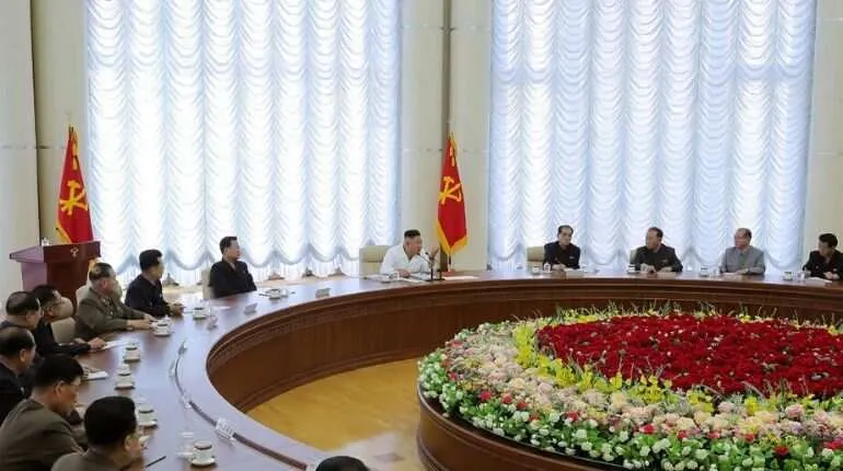 This picture taken on June 7, 2020 and released from North Korea's official Korean Central News Agency (KCNA) on June 8, 2020 shows North Korean leader Kim Jong Un (C) attending the 13th Political Bureau meeting of the 7th Central Committee of the Workers' Party of Korea (WPK) in an undisclosed location in North Korea. 